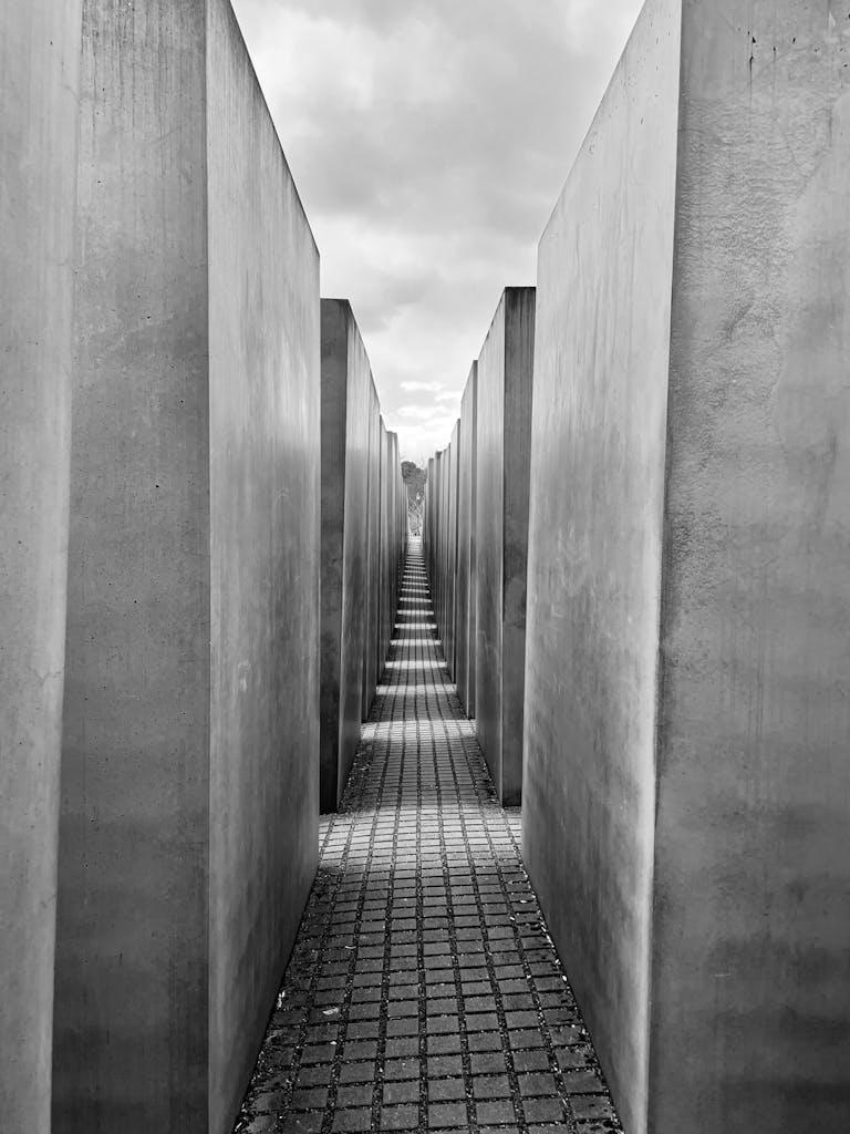 Black and white photograph of Berlin's Holocaust Memorial's architectural pathway.